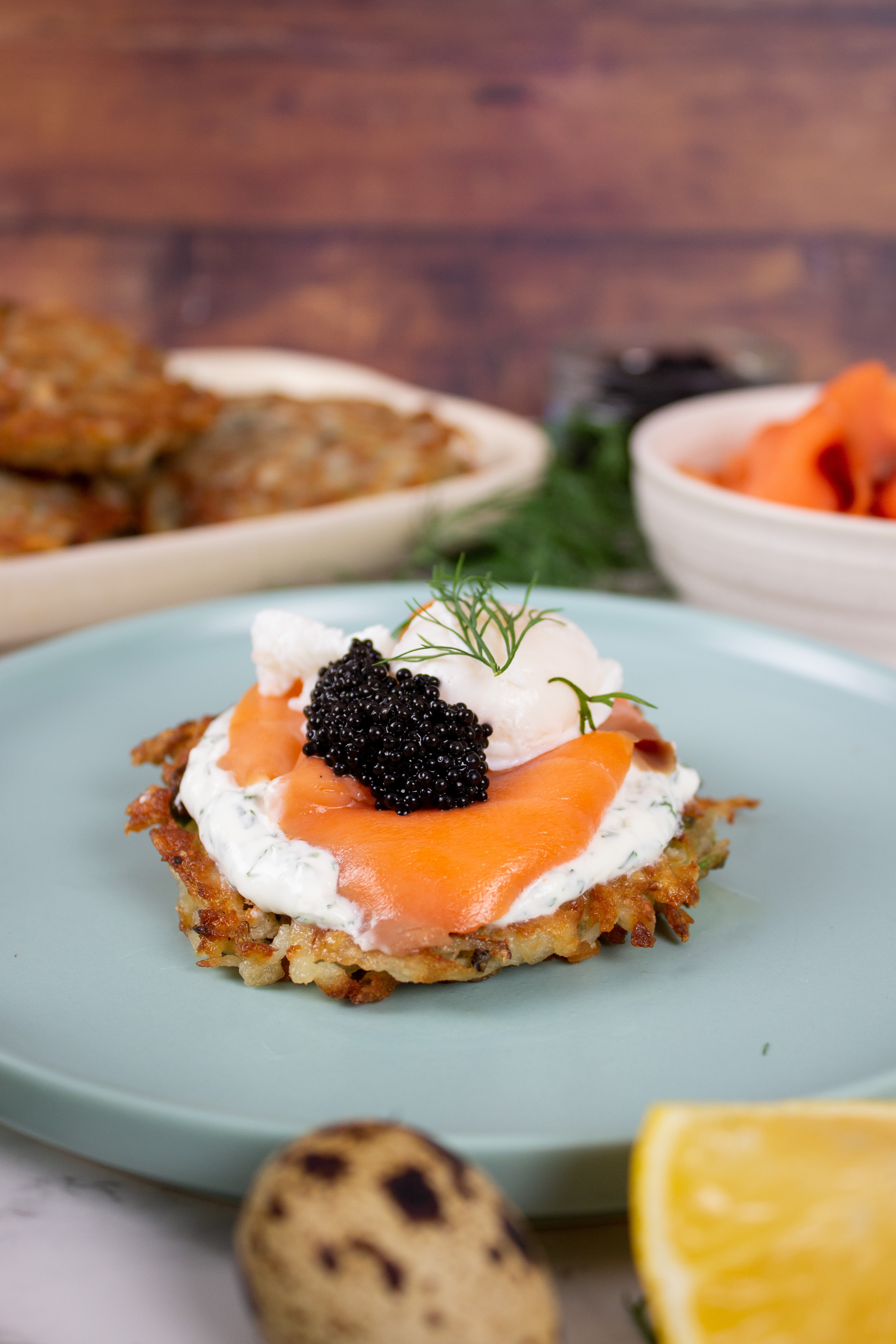 Potato Latkes with Poached Quail Eggs, Lemon Dill Crème Fraîche and Caviar
