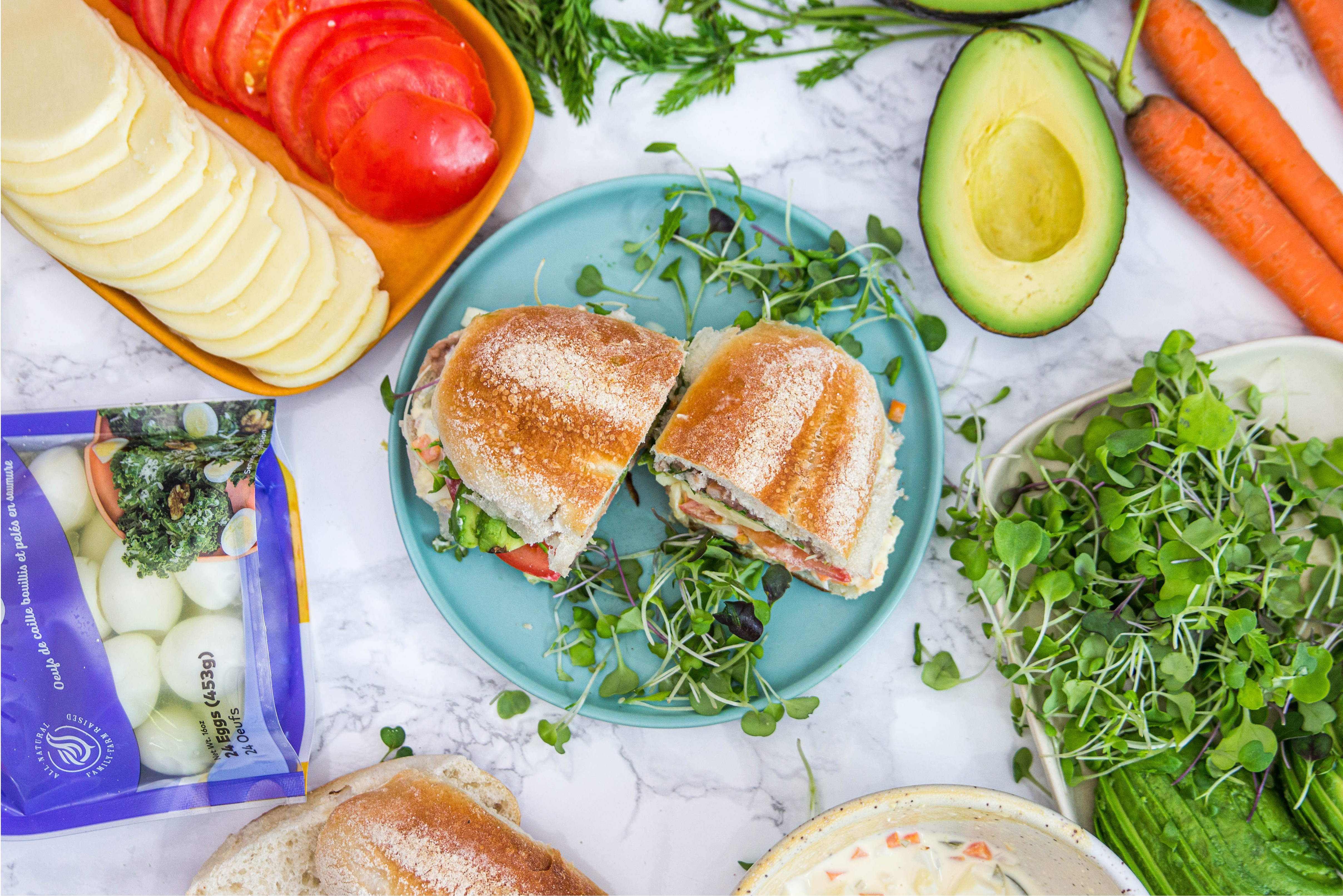 sandwich on plate with greens