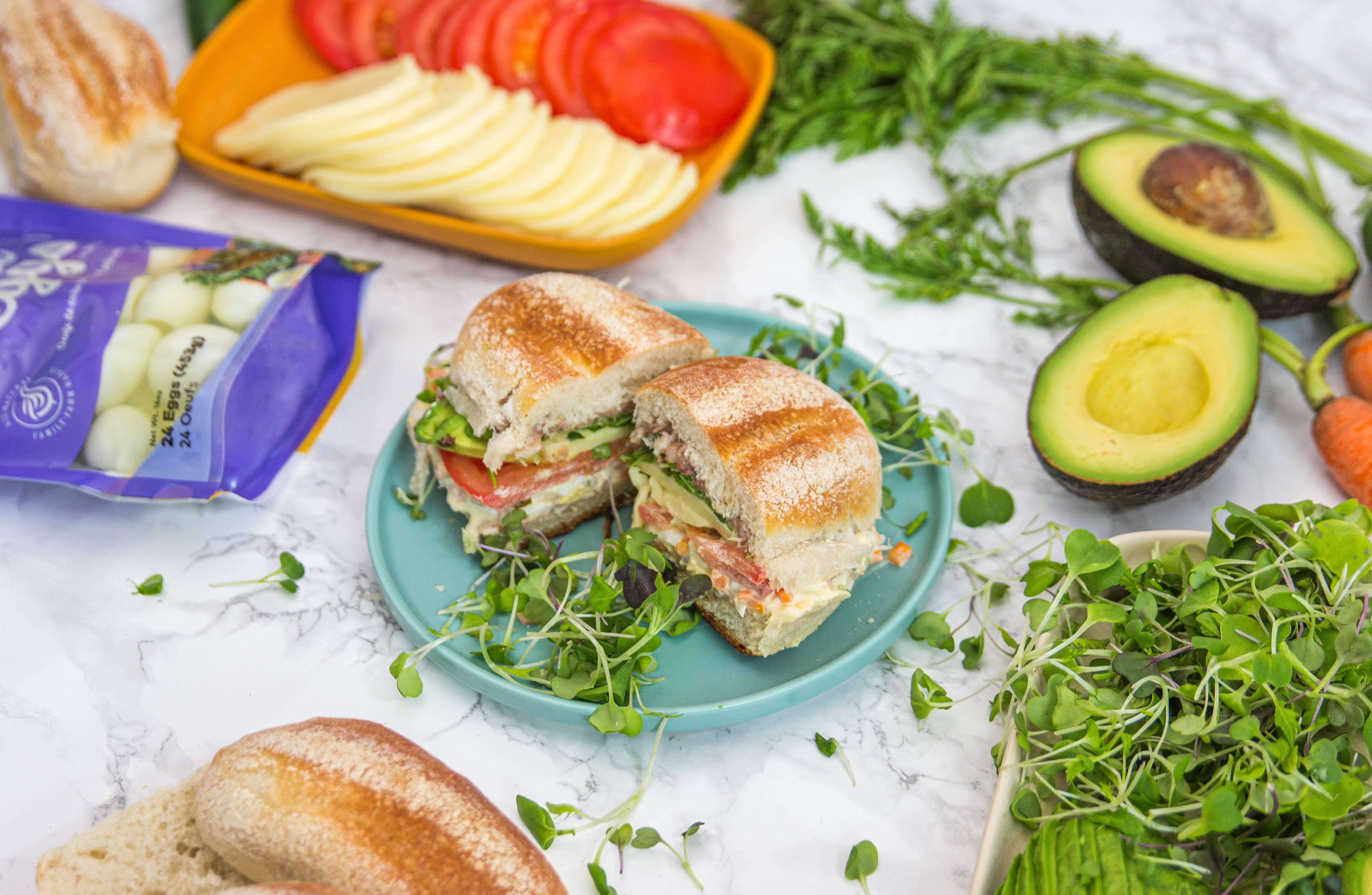 sandwich on plate with greens