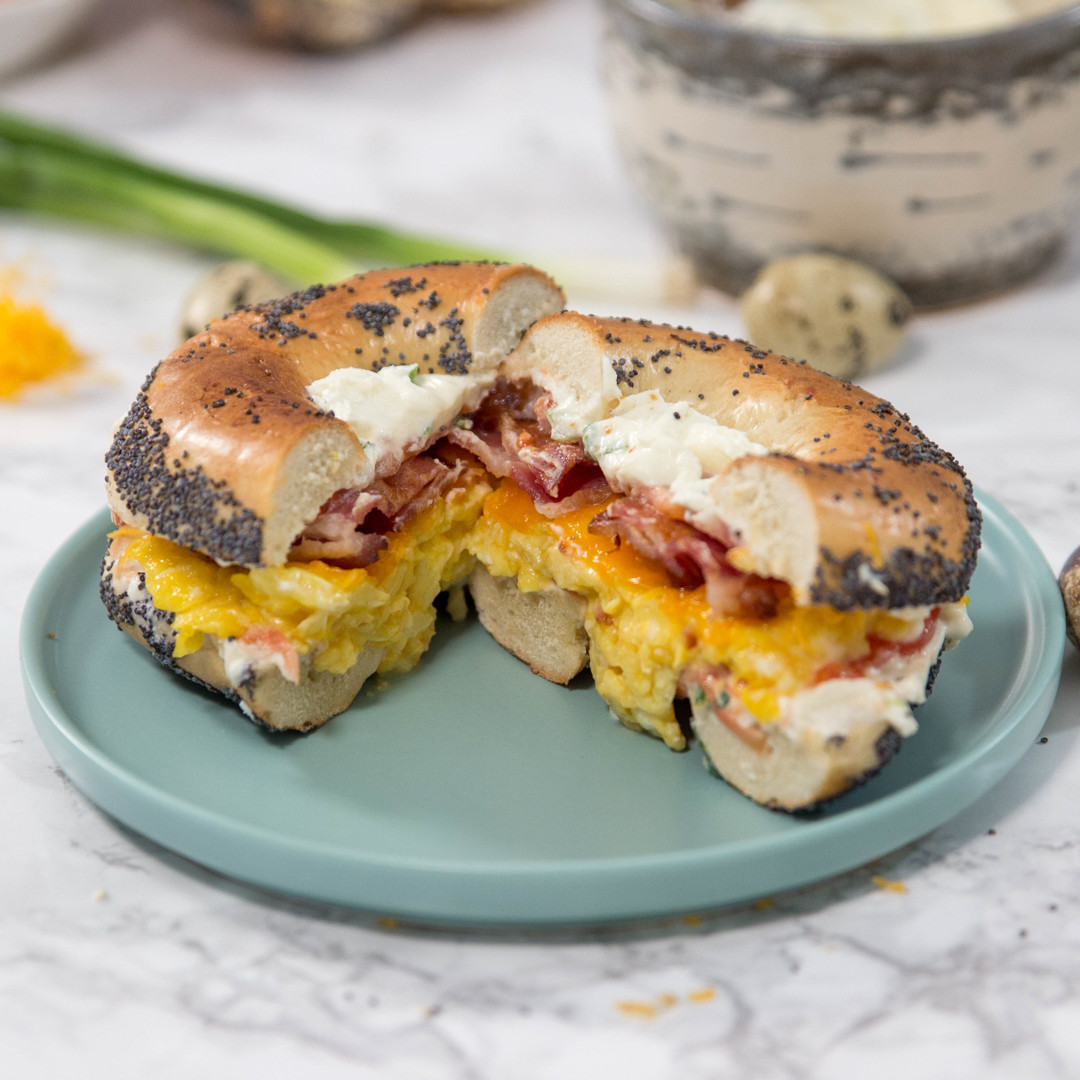 Bagel with quail eggs and bacon